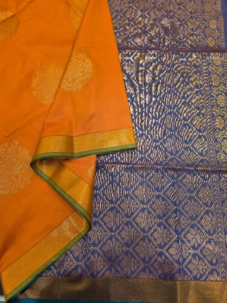 Orange Semi Kanchipuram Silk Saree with Gold Zari Floral Buttas & Royal Blue Brocade Pallu
