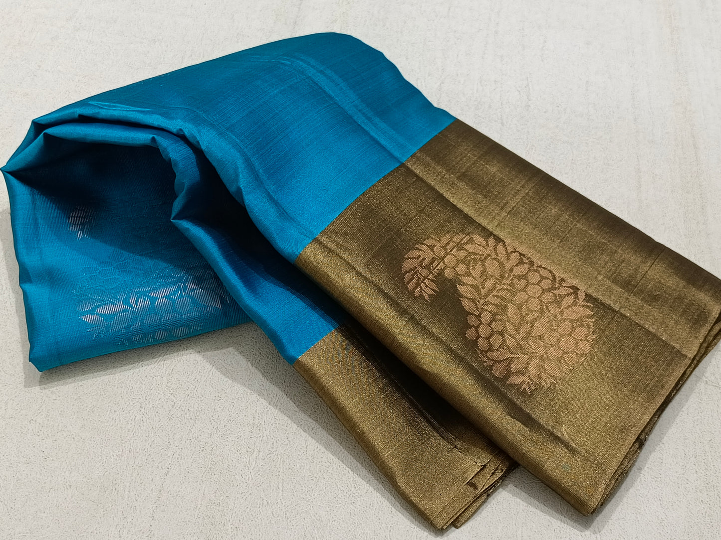 Contemporary Blue saree With Bronze Border And Copper Pallu