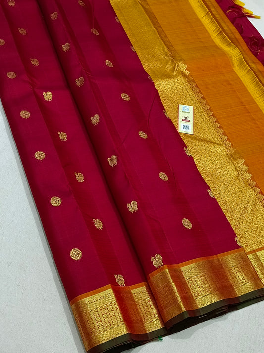 Traditional red kanchipuram silk saree with turmeric border