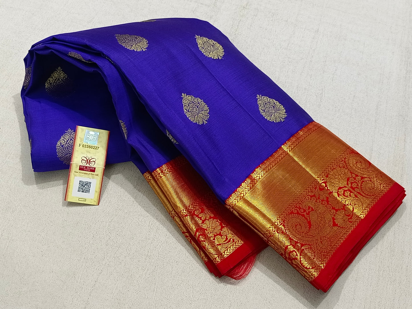 Traditional blue kanchipuram silk saree with red border