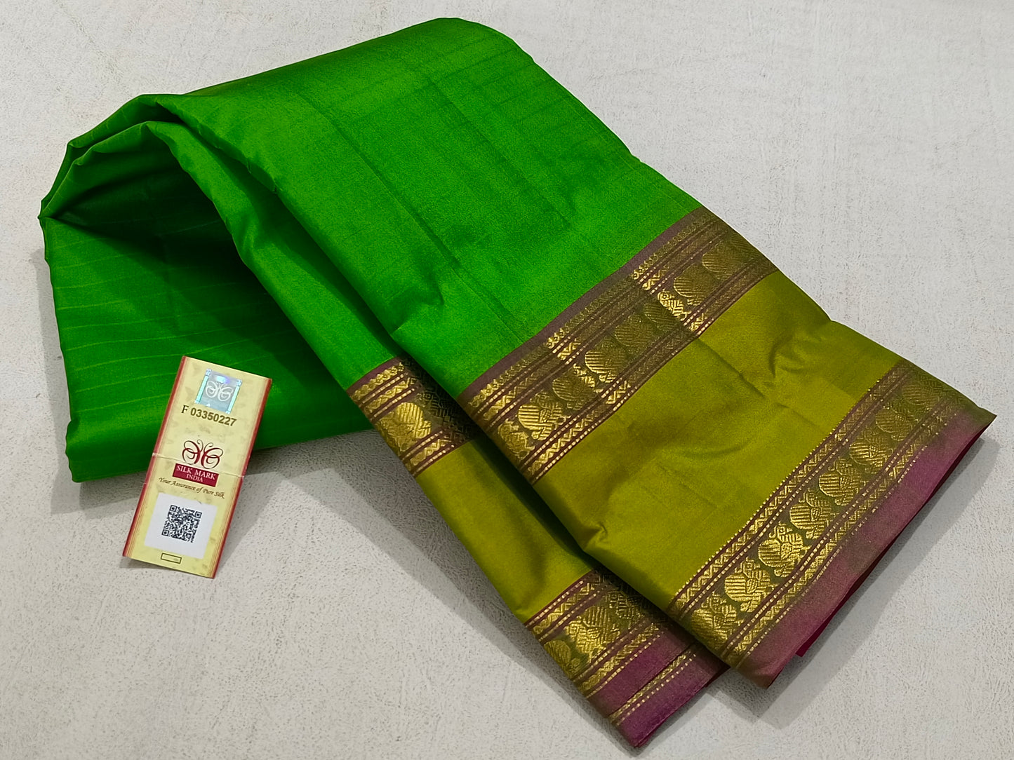 Traditional green kanchipuram silk saree with pink pallu