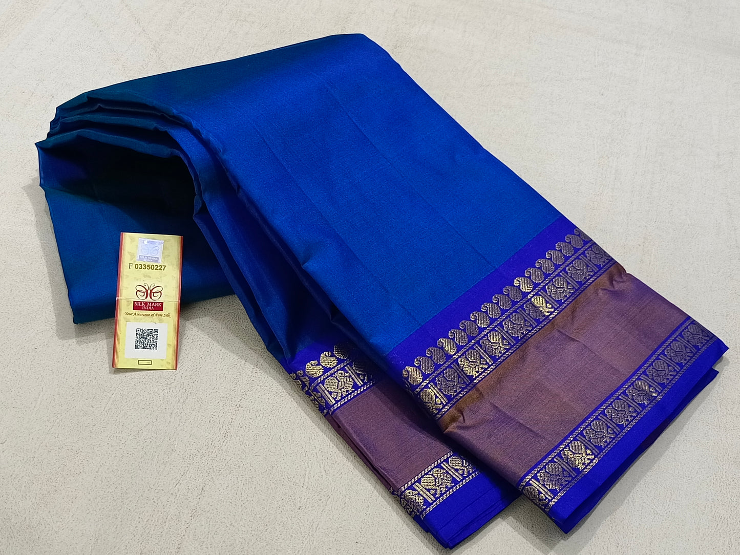 Traditional blue kanchipuram silk saree with copper border