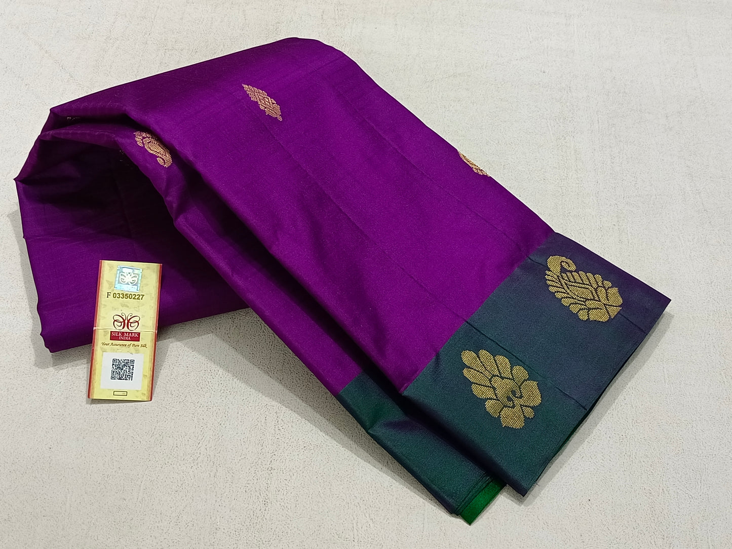 Traditional violet kanchipuram silk saree with green border