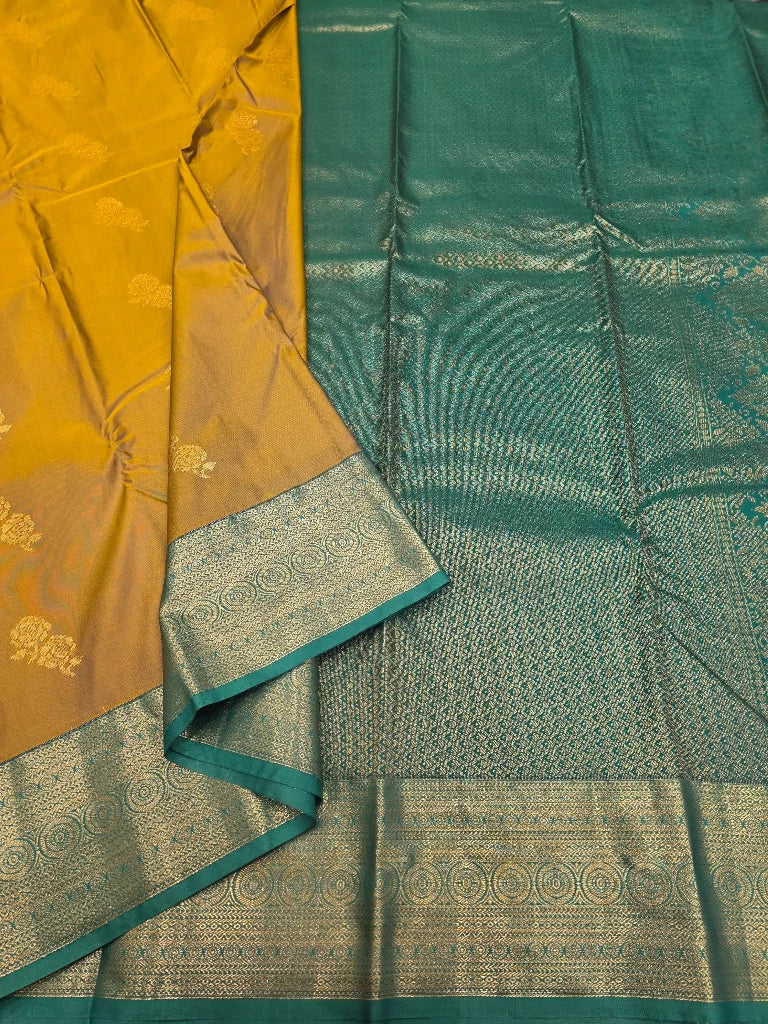 Mustard Yellow Semi Kanchipuram Silk Saree with Peacock Green Gold Zari Border & Rich Brocade Pallu