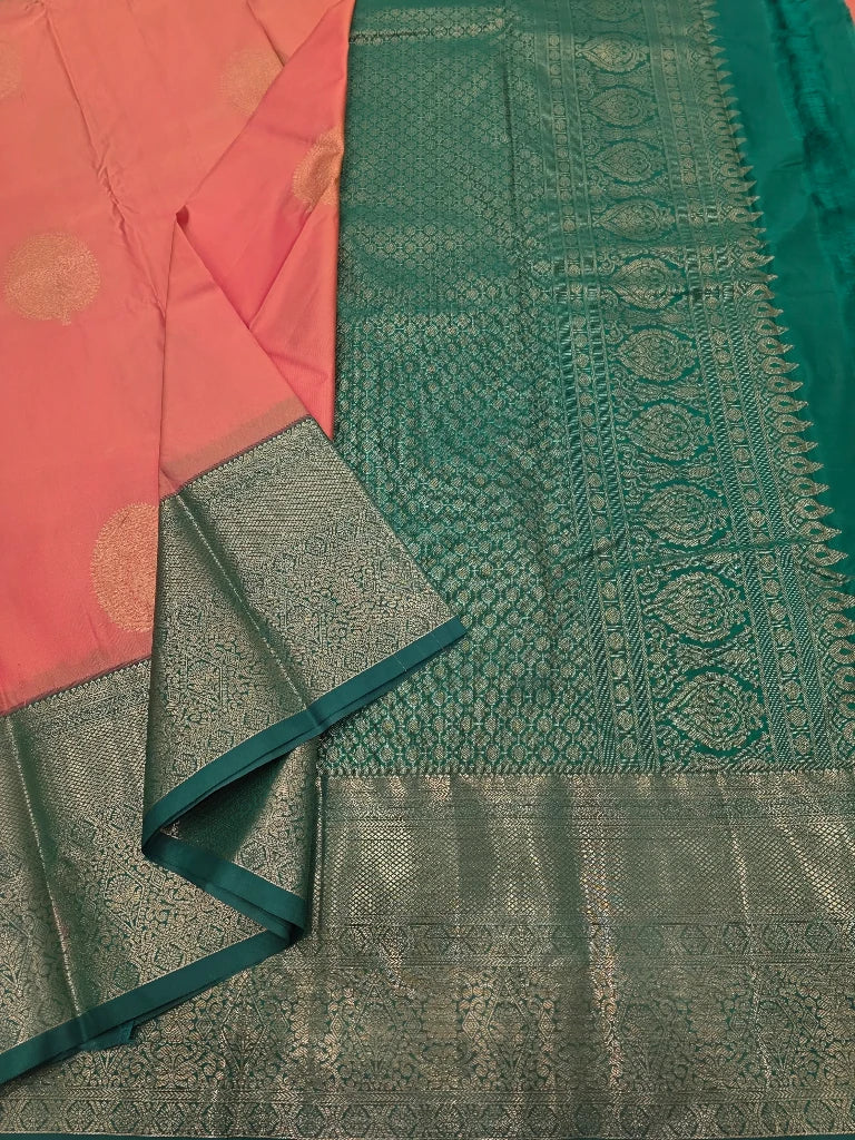 Peach Pink Semi Kanchipuram Silk Saree with Gold Zari Buttas & Rich Emerald Green Pallu