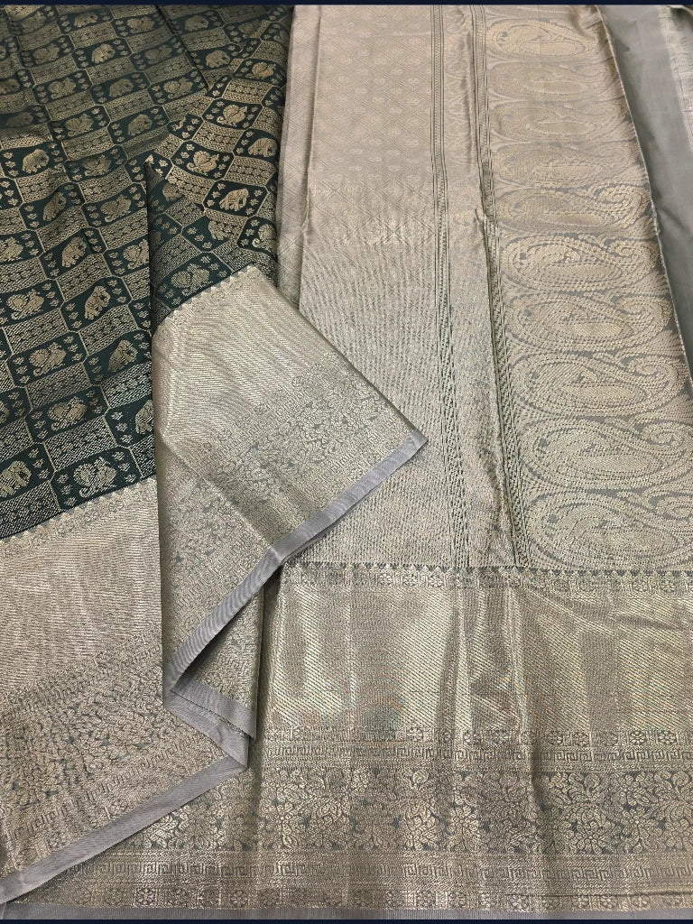 Dark Bottle Green Semi Kanchipuram Silk Saree with Silver Zari Elephant Motifs & Rich Contrast Pallu
