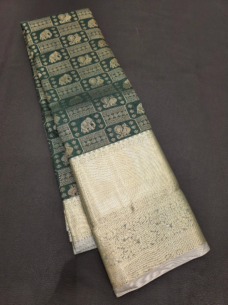 Dark Bottle Green Semi Kanchipuram Silk Saree with Silver Zari Elephant Motifs & Rich Contrast Pallu