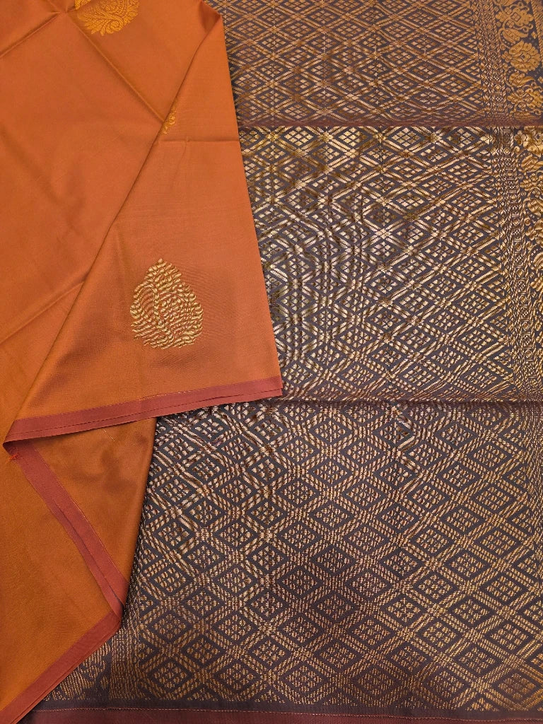 Copper Orange Semi Kanchipuram Silk Saree with Gold Zari Paisley Buttas & Purple Brocade Pallu