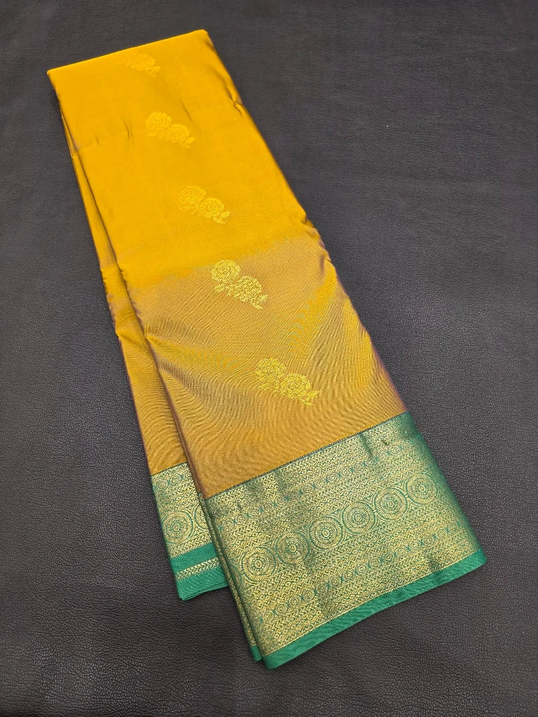 Mustard Yellow Semi Kanchipuram Silk Saree with Peacock Green Gold Zari Border & Rich Brocade Pallu