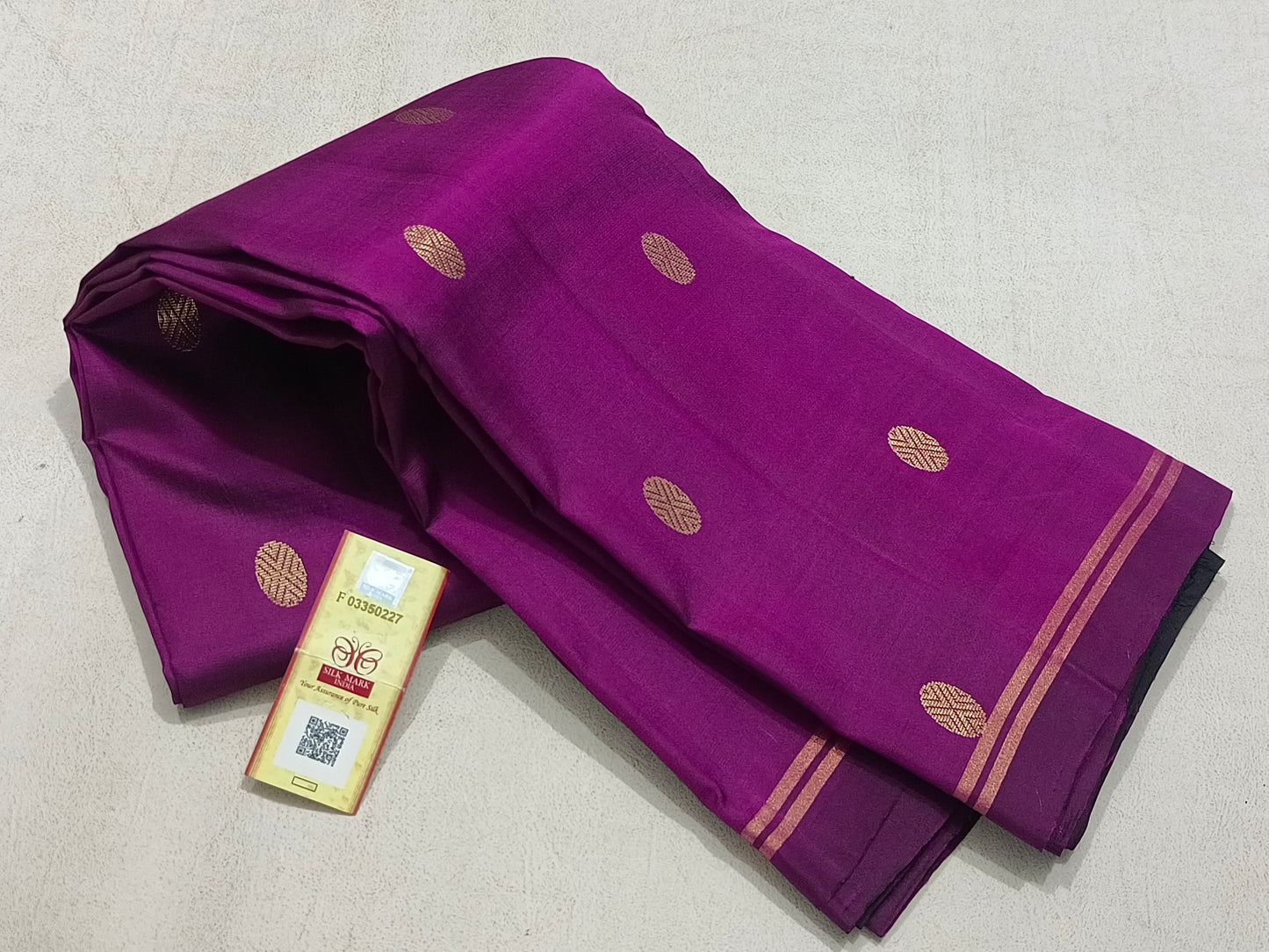 Traditional magenta kanchipuram silk saree with black border