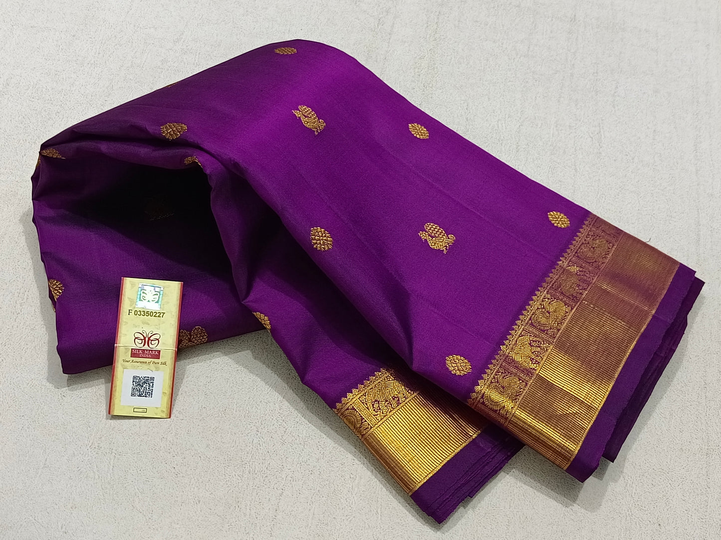 Traditional violet kanchipuram silk saree with zari border