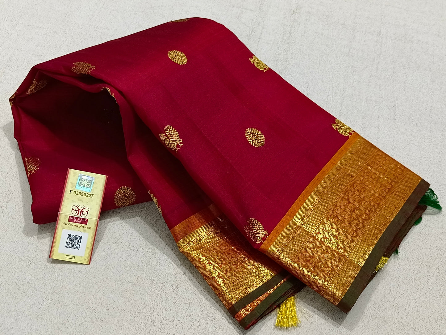 Traditional red kanchipuram silk saree with turmeric border