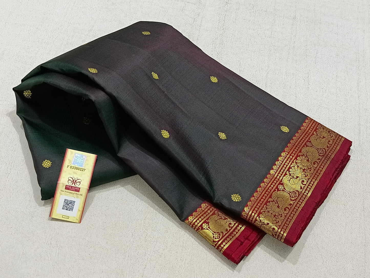 Traditional dark grey kanchipuram silk saree with red border