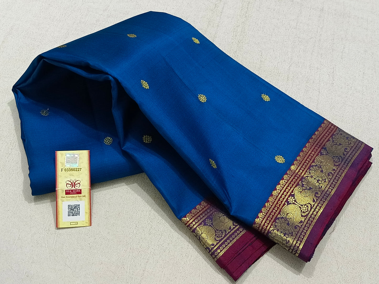 Traditional blue kanchipuram silk saree with purple border