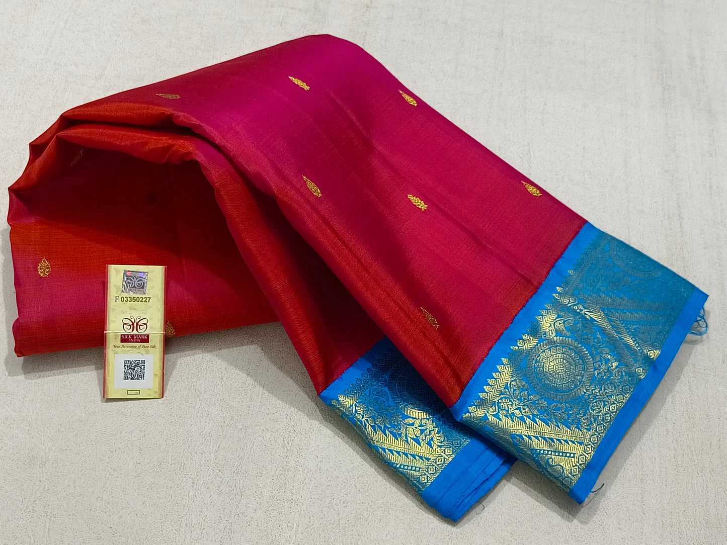 Traditional red kanchipuram silk saree with blue border