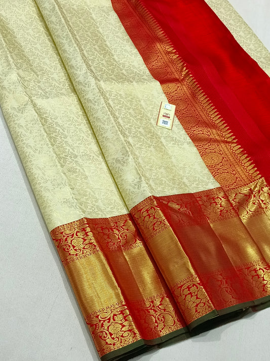 Traditional white kanchipuram silk saree with red border