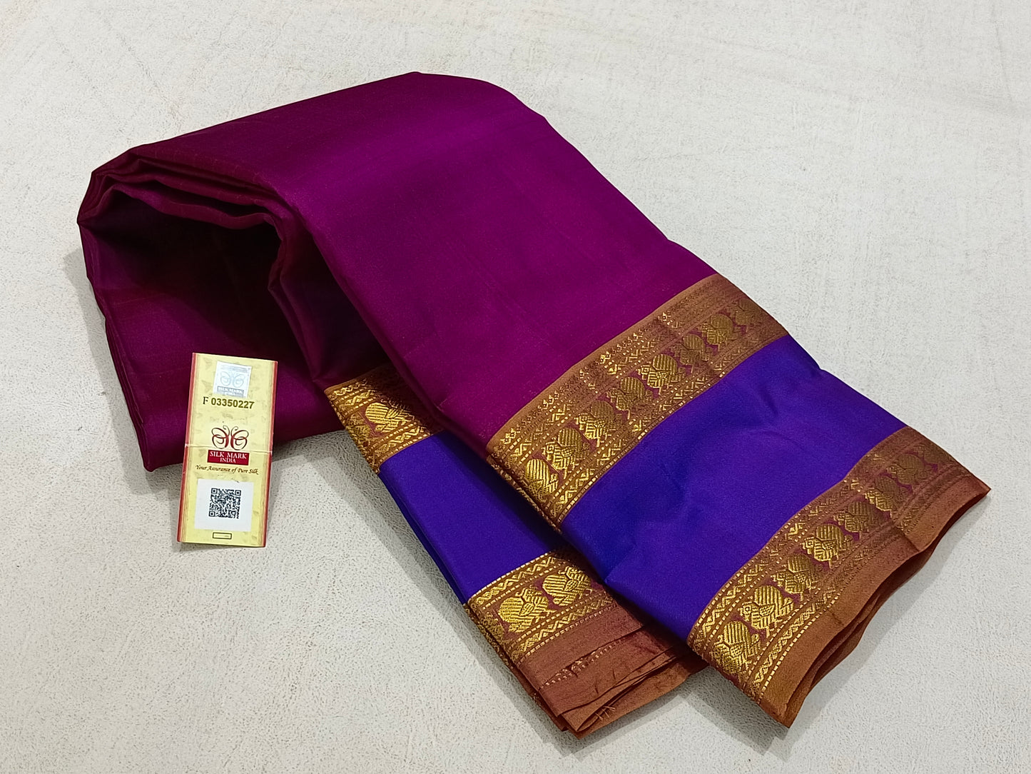 Traditional magenta kanchipuram silk saree with blue border
