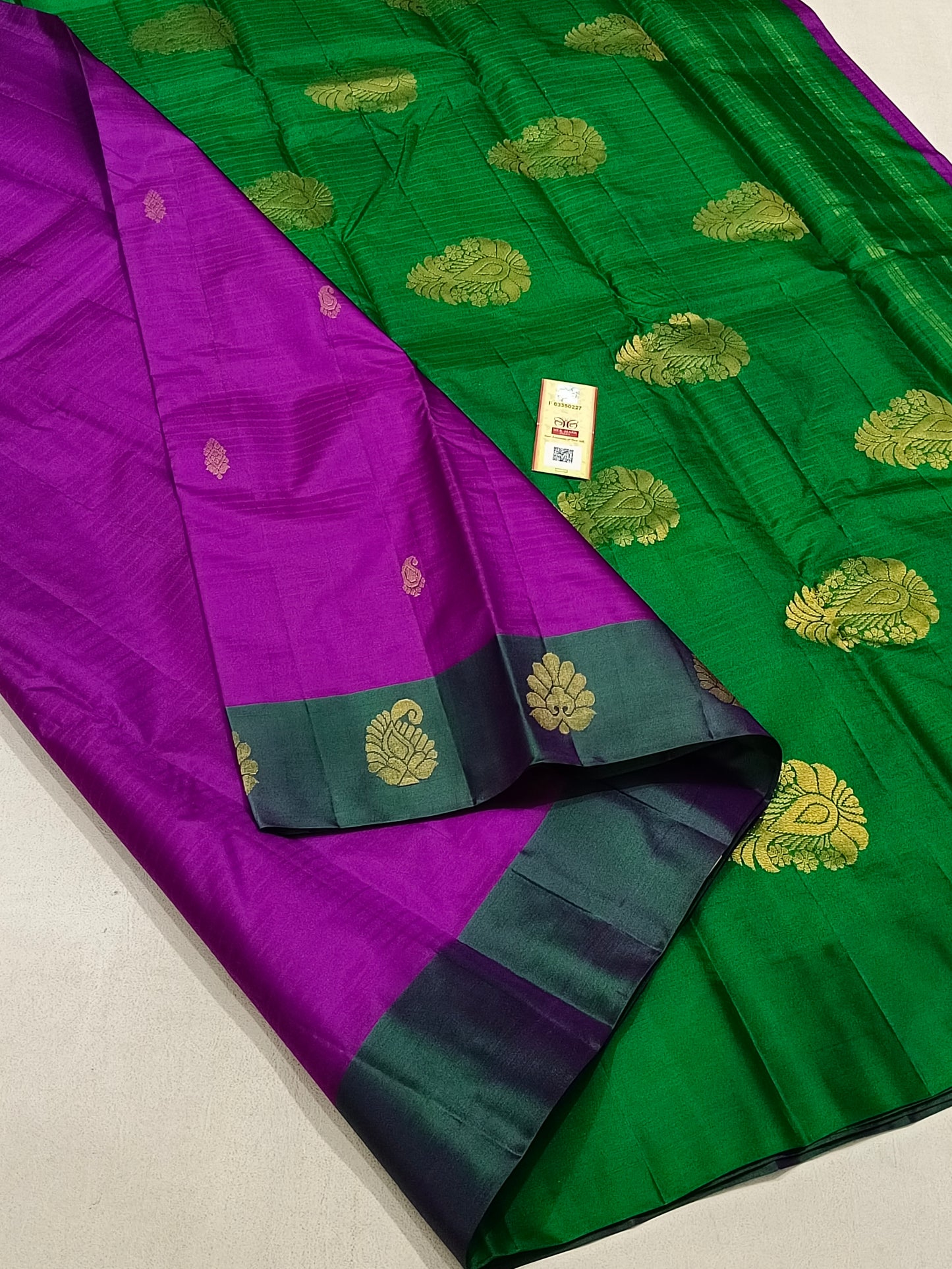 Traditional violet kanchipuram silk saree with green border