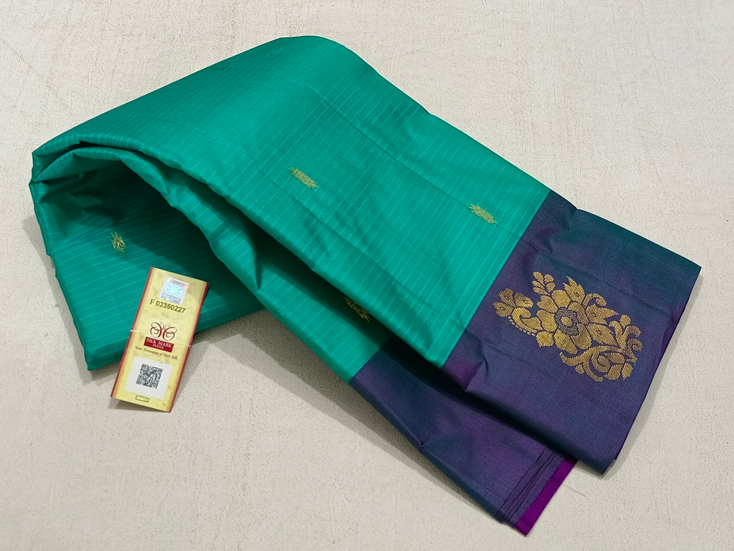 Traditional teal kanchipuram silk saree with violet border