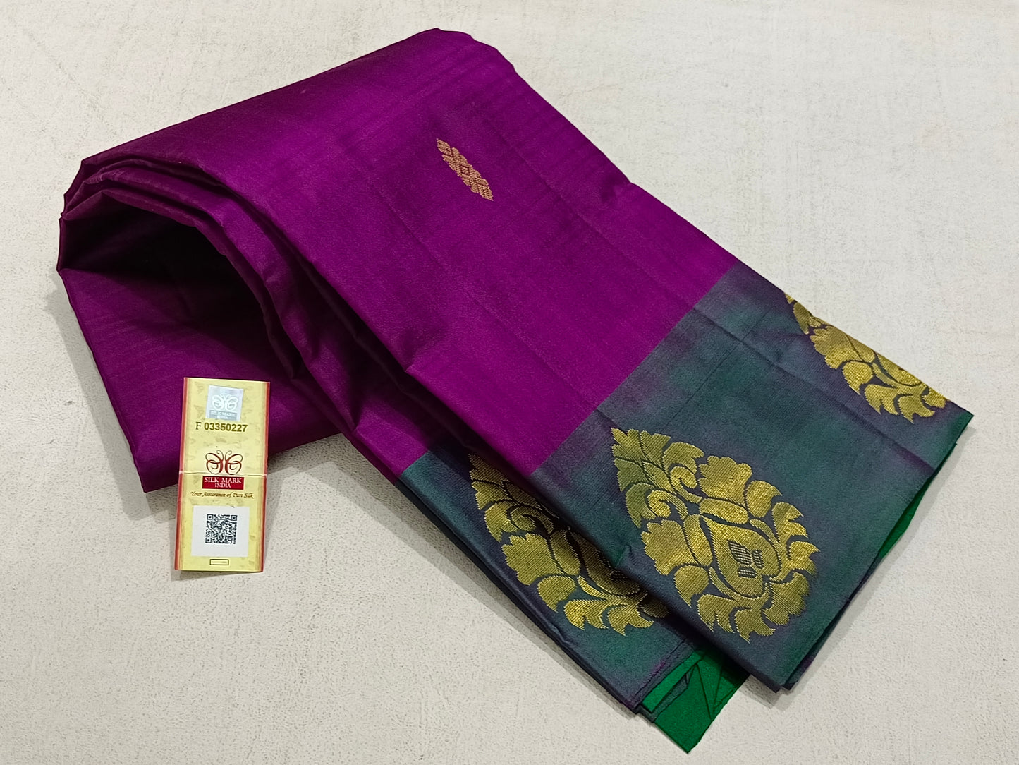 Traditional magenta kanchipuram silk saree with green pallu