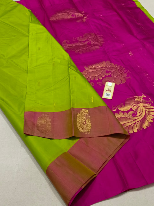 Traditional parrot green kanchipuram silk saree with pink border