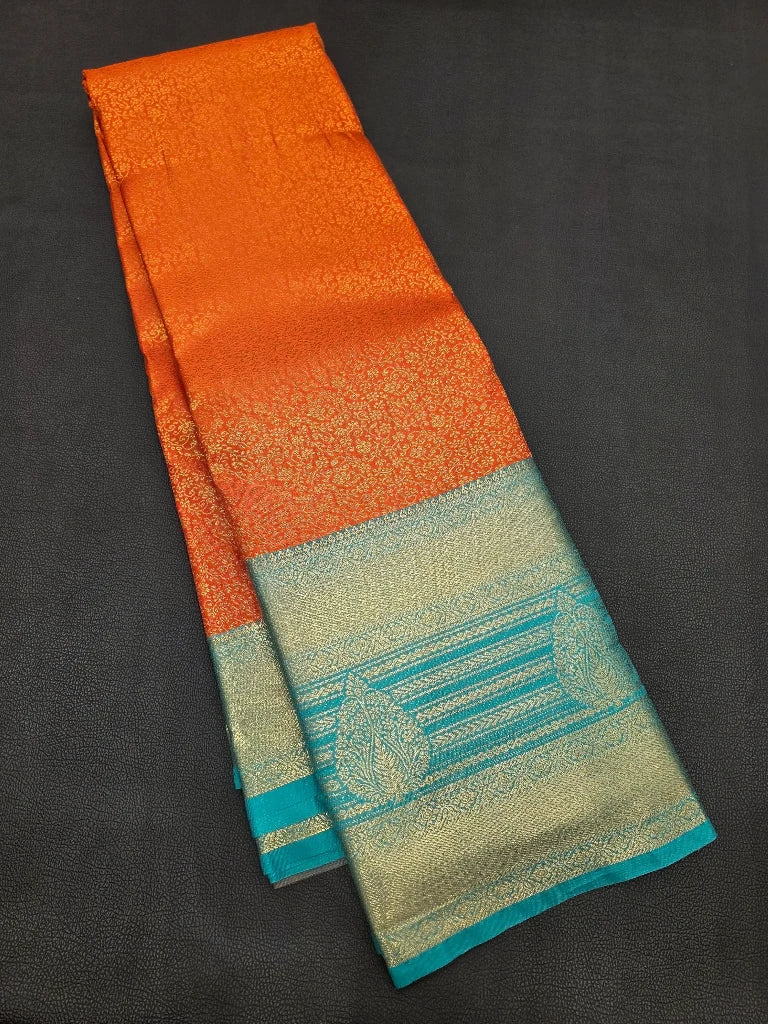 Burnt Orange Semi Kanchipuram Silk Saree with Peacock Blue Zari Border & Rich Gold Pallu