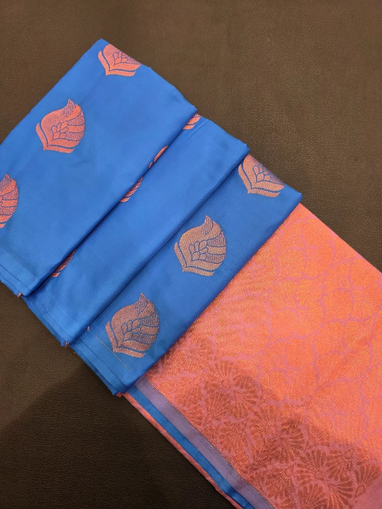 Royal Blue Semi Kanchipuram Silk Saree with Copper Zari Buttas & Rich Orange Brocade Pallu