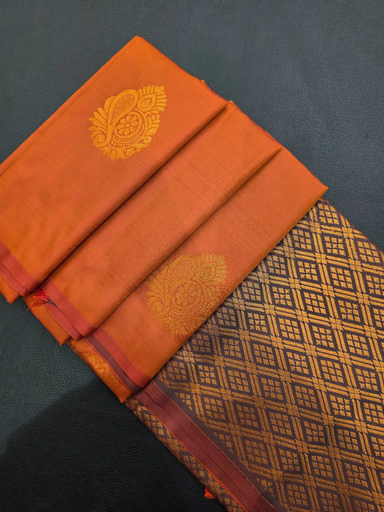Copper Orange Semi Kanchipuram Silk Saree with Gold Zari Paisley Buttas & Purple Brocade Pallu